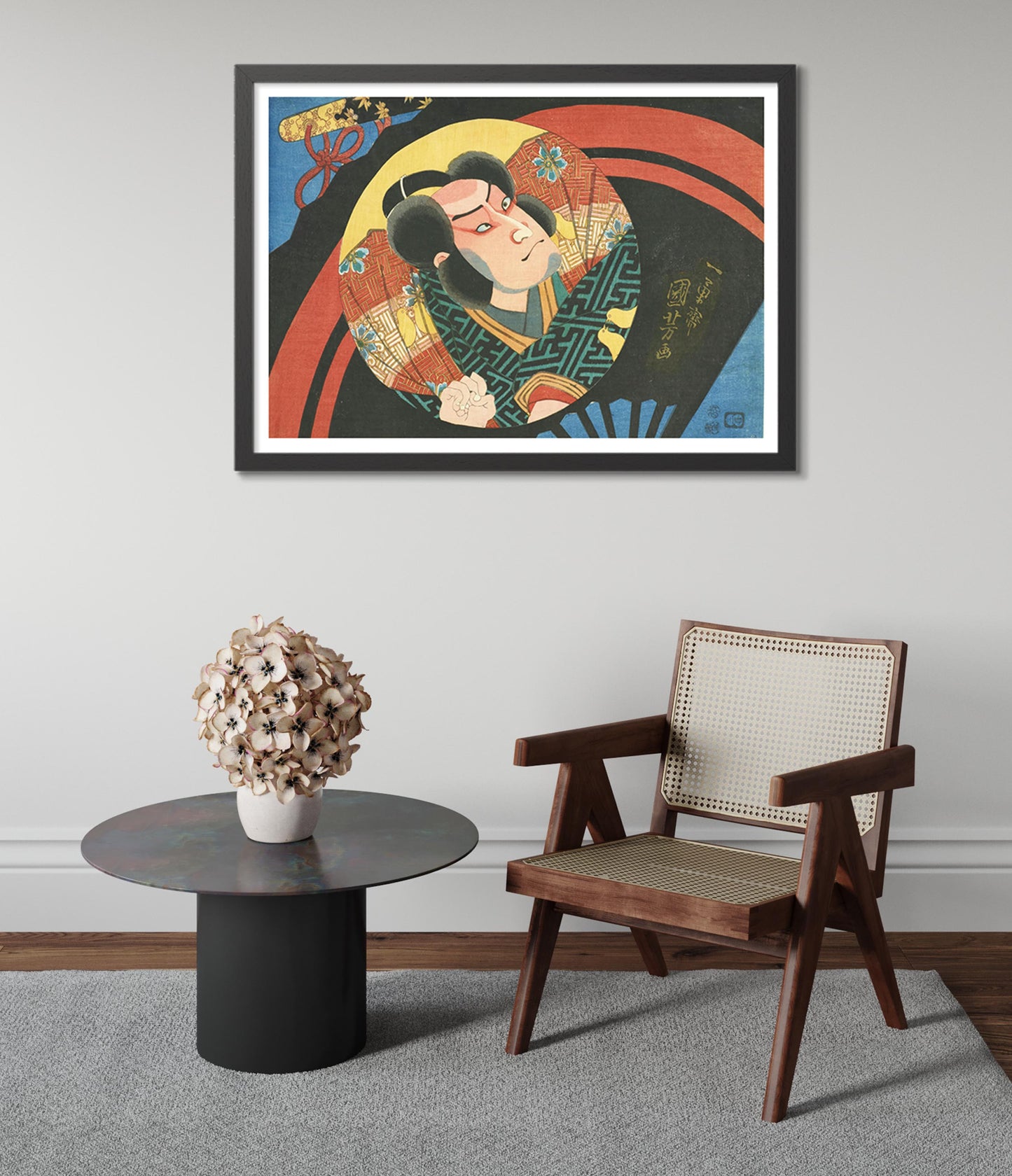 En Kabuki-skådespelare på en vikbar solfjäder